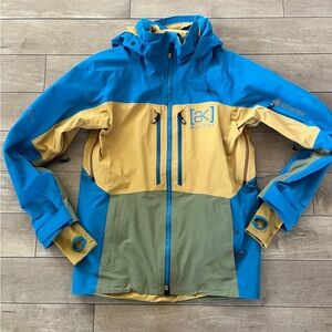Burton AK Gore‑Tex 3L snowboard jacket in blue, mustard & olive